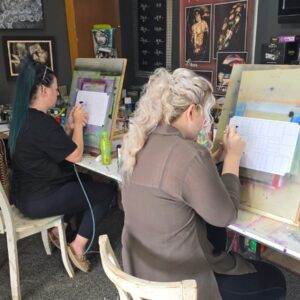 Basics class with students working on straight lines and control sheets